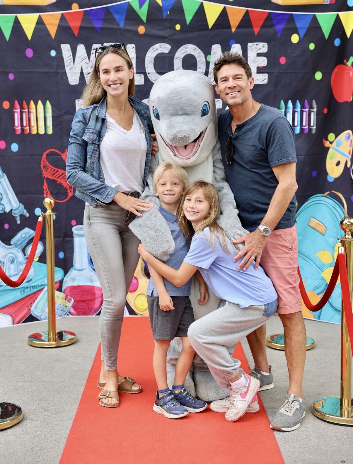 A Cold Spring family poses with the school mascot at a welcome event
